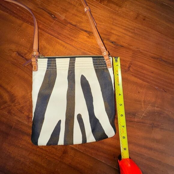 Dooney and Bourke Small Triple Zip Zebra Print Crossbody Bag
EUC - Picture 4 of 9